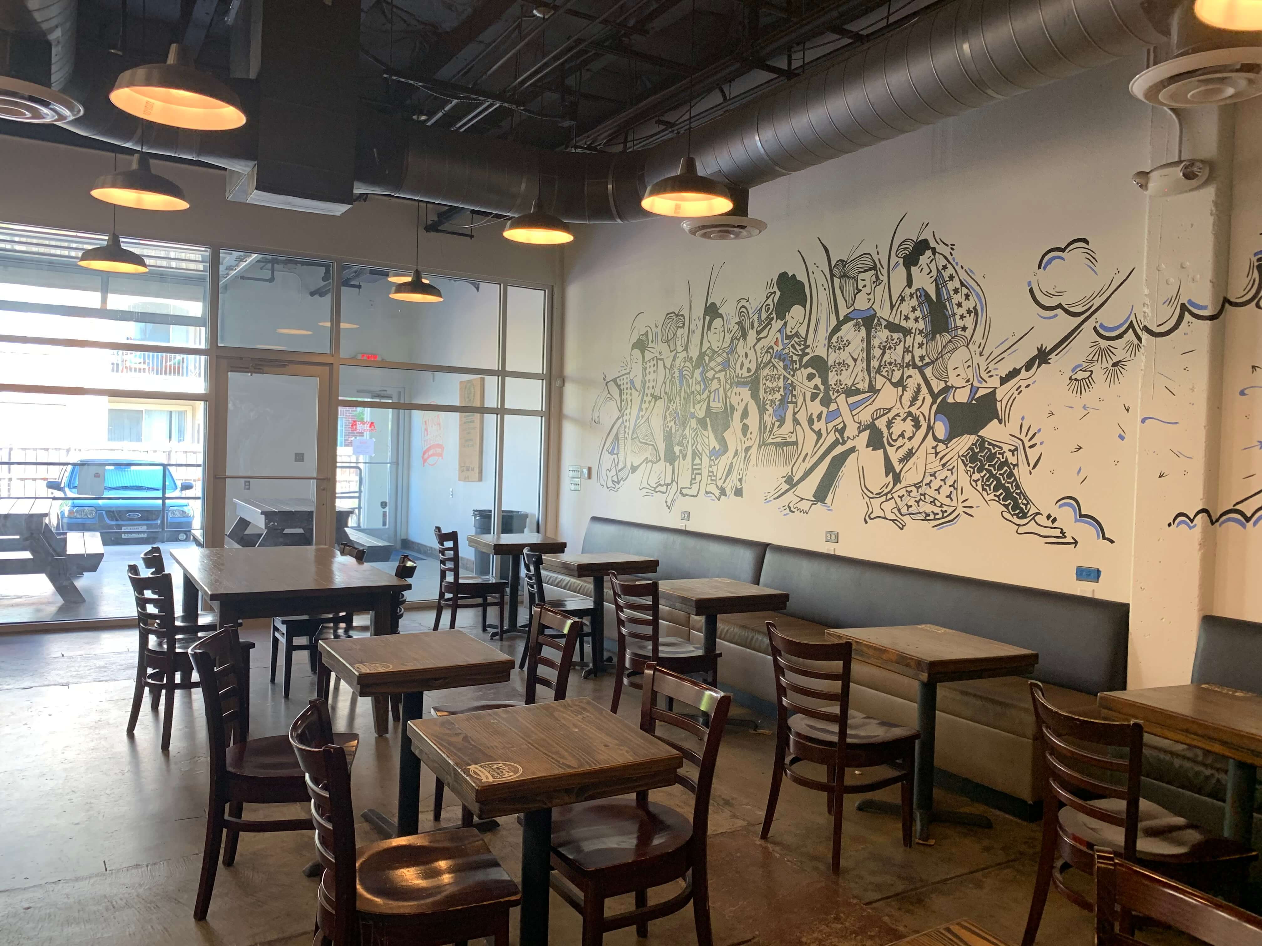 Mural and seating at Avoca Coffee Roasters in West 7th Cultural District, Fort Worth, Texas