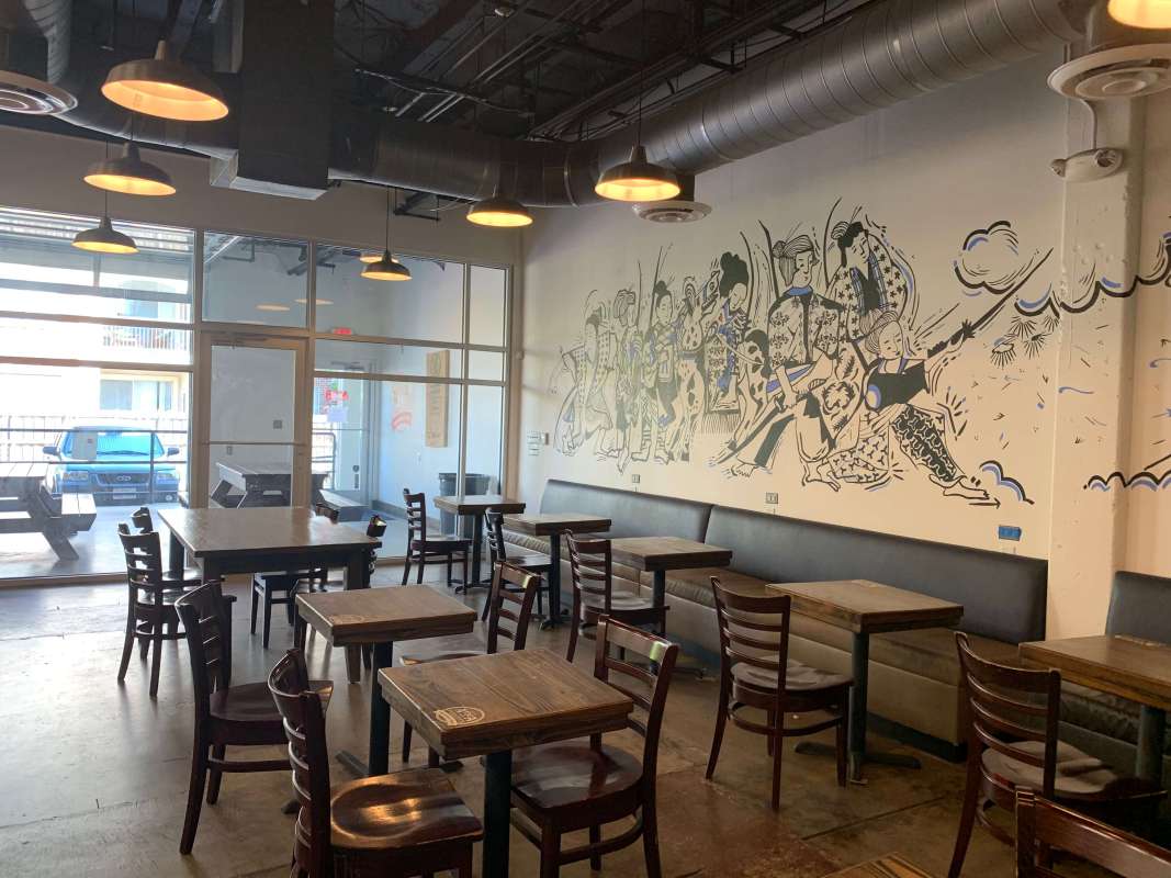 Mural and seating at Avoca Coffee Roasters in West 7th Cultural District, Fort Worth, Texas